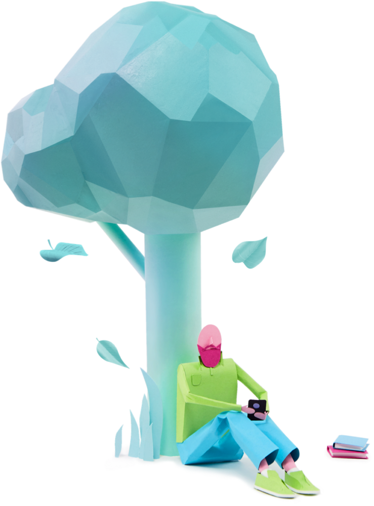 Paper man sitting under tree